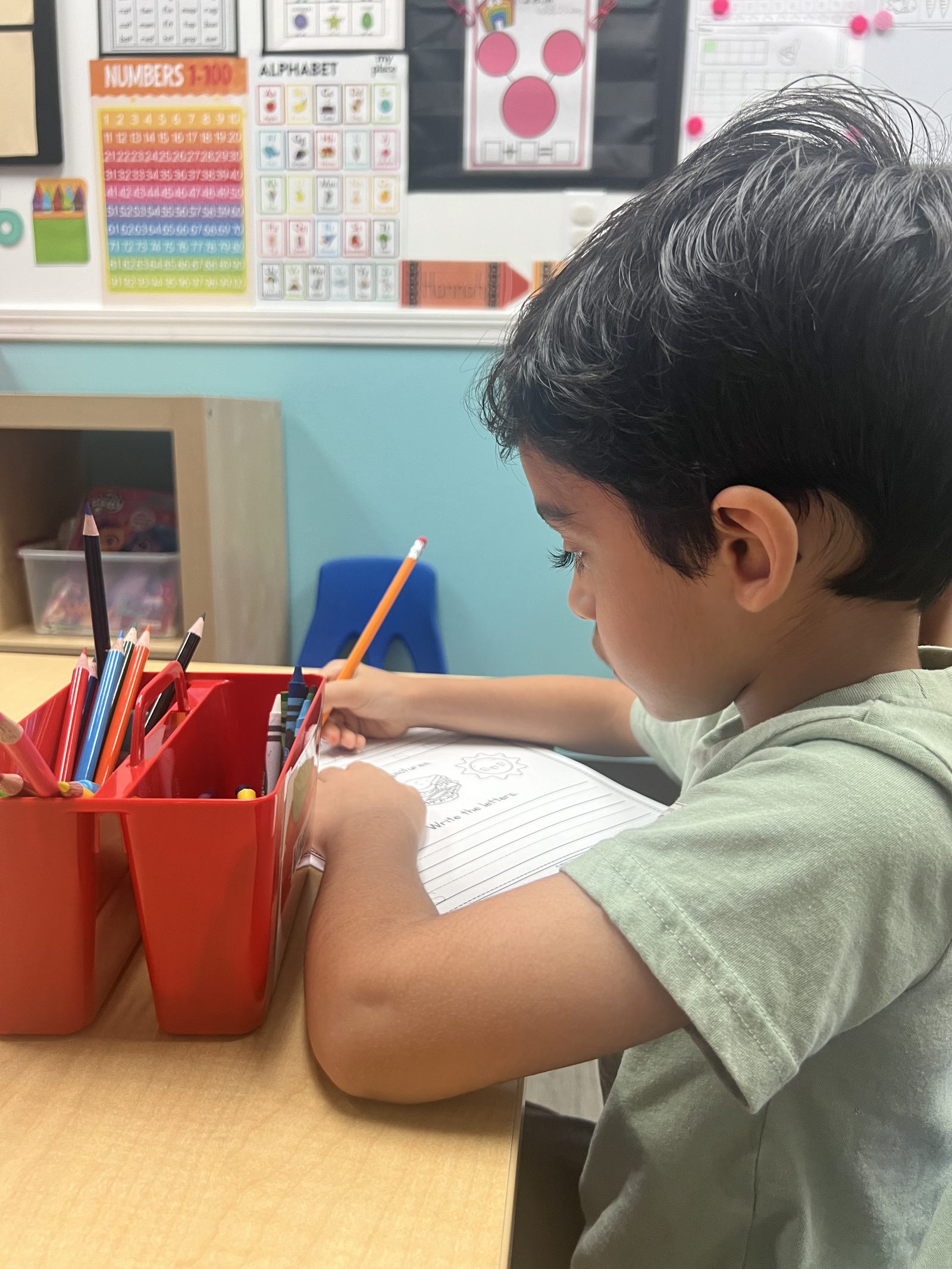 A summer camper journaling at MyPlace, Katy TX