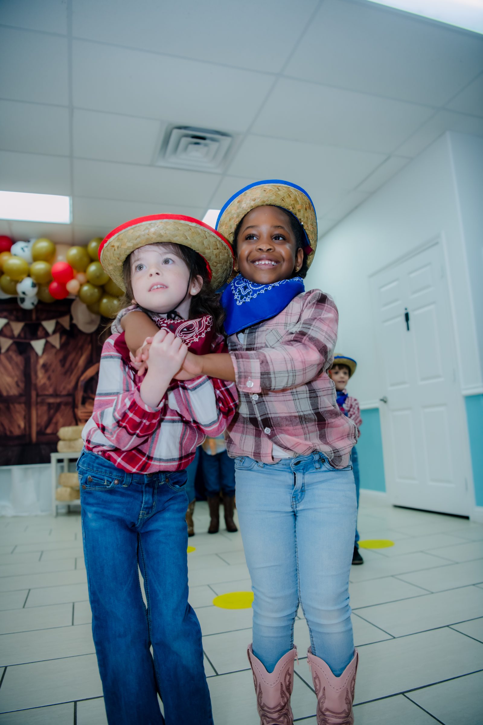 Two happy Pre-K friends hugging at MyPlace in Katy, TX