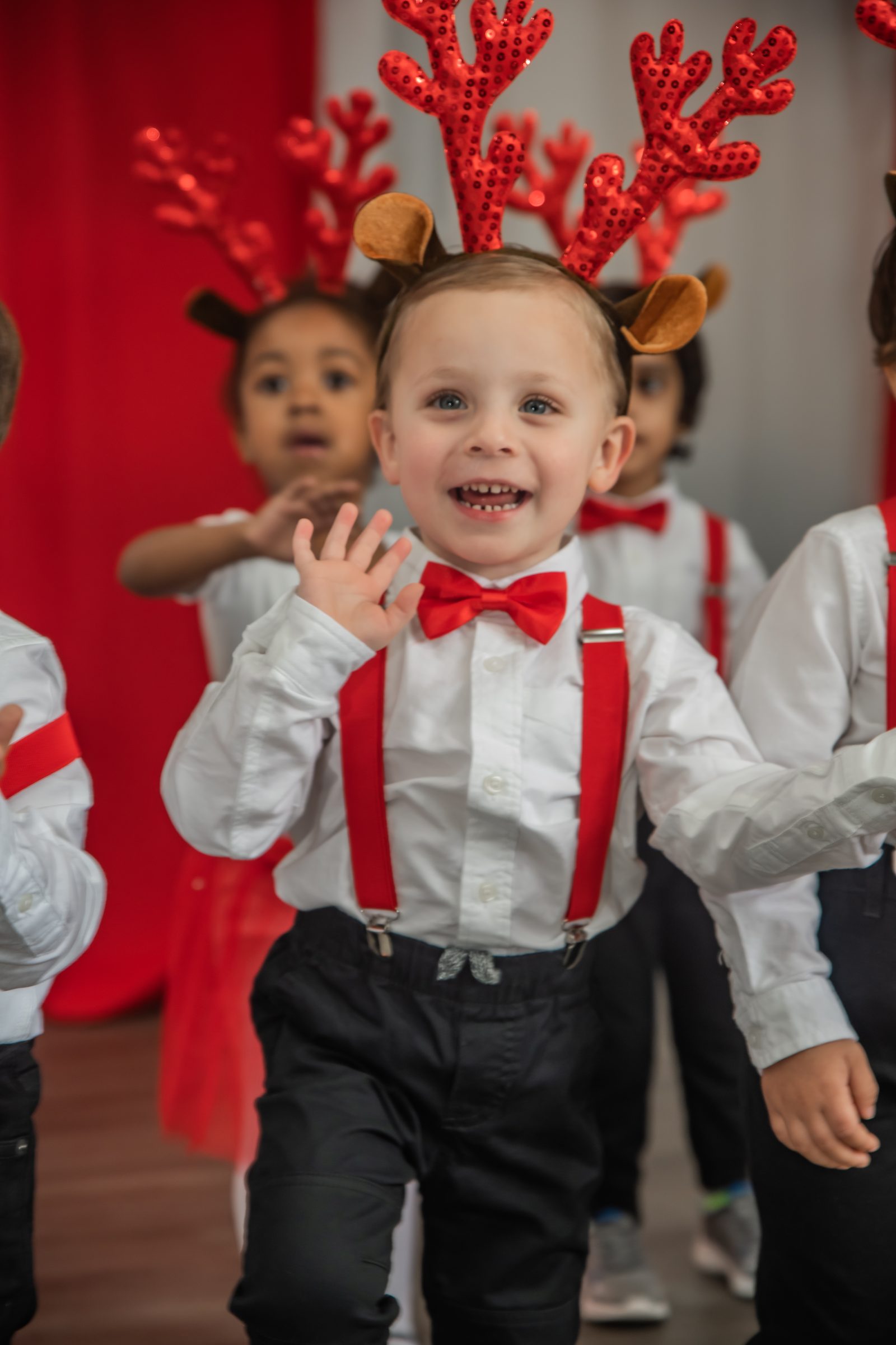 A joyful preschooler at a MyPlace recital in Katy, TX