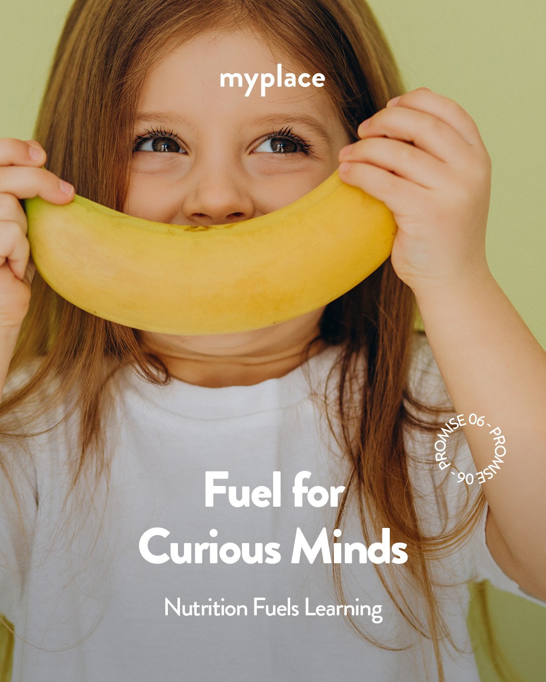 A child holds a banana like a smile — Fuel for Curious Minds, nutrition at MyPlace Early Learning Center