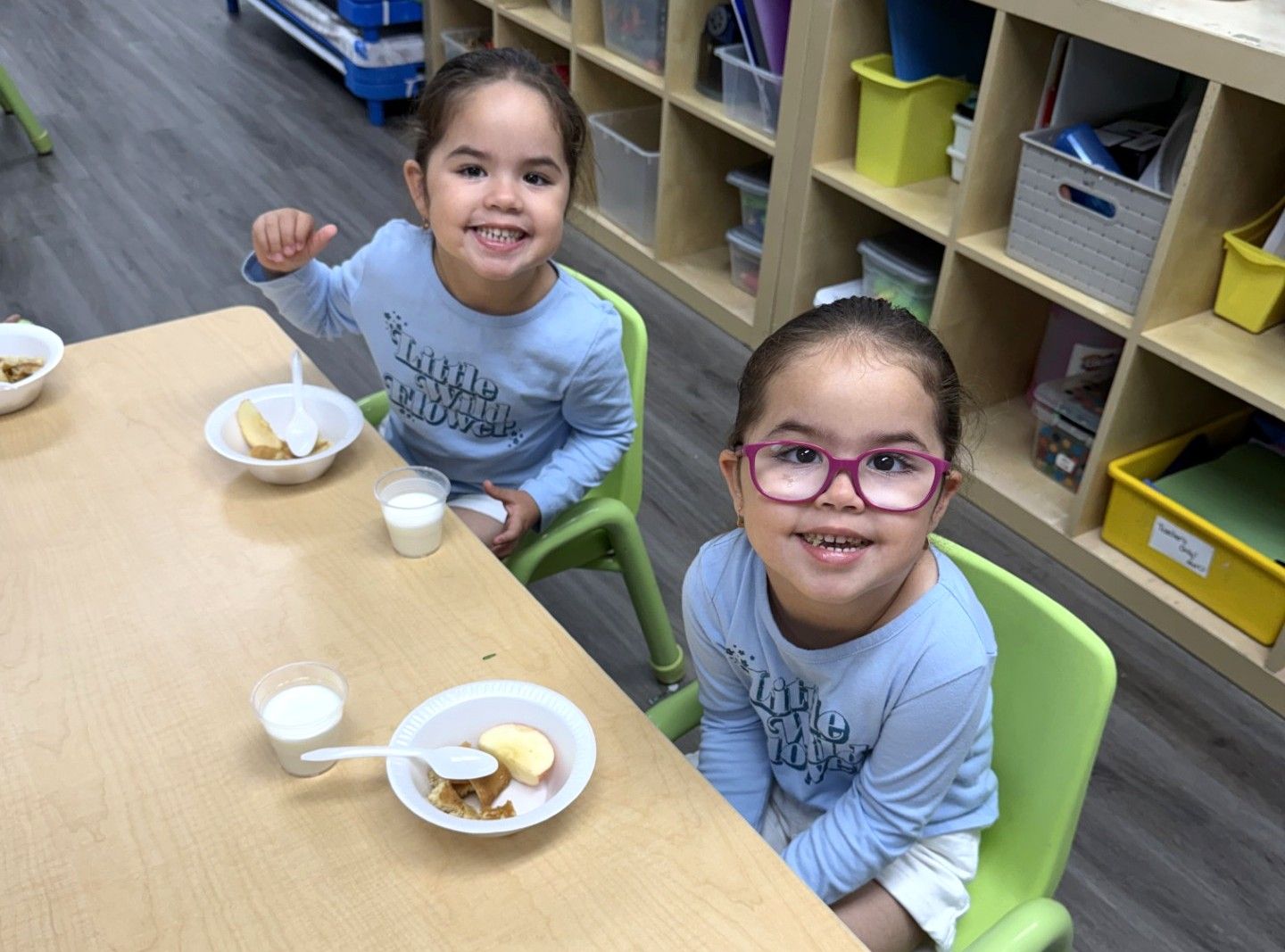 Children eating a healthy snack together at MyPlace